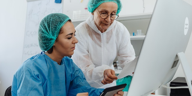 Medical-research Two individuals conducting medical research involving RTSM in Clinical Research