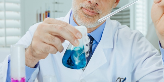 an-experiment-lab A clinical researcher experimenting in a lab