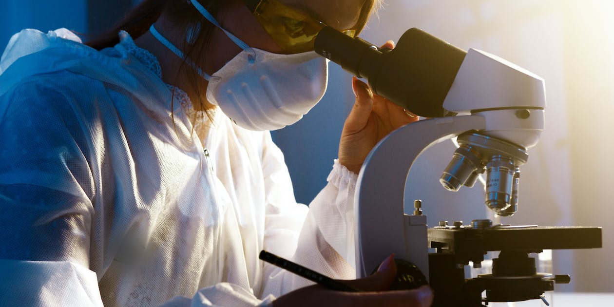 photo-of-woman-looking-through-camera A researcher looking through a microscope