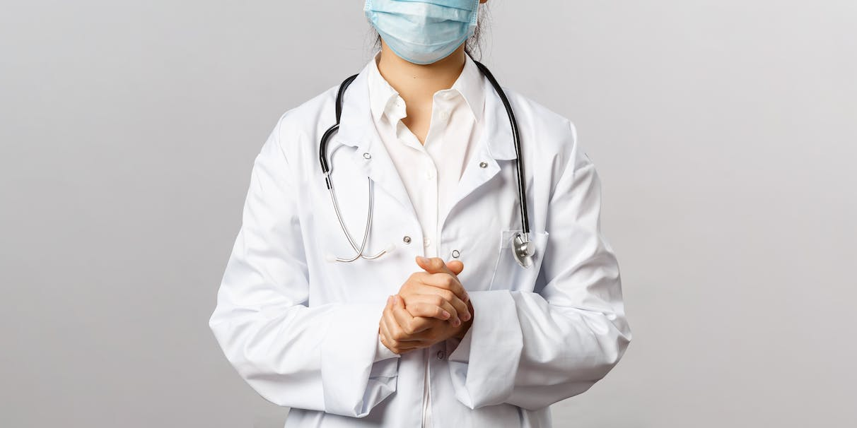 a doctor wearing a lab coat and stethoscope.