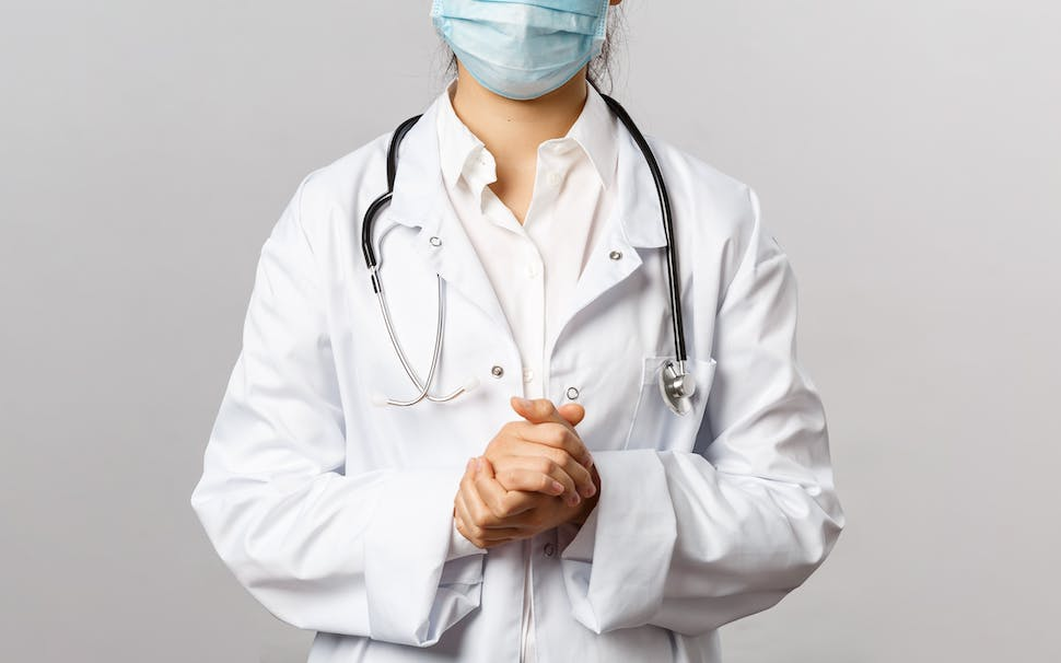 a doctor wearing a lab coat and stethoscope.