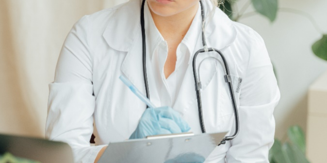 Researcher making notes.