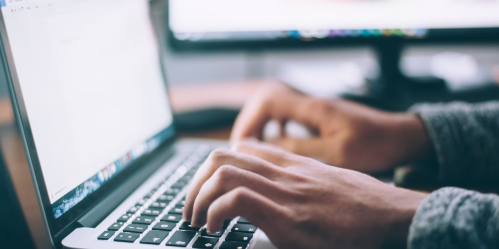 Person using laptop for DCT.