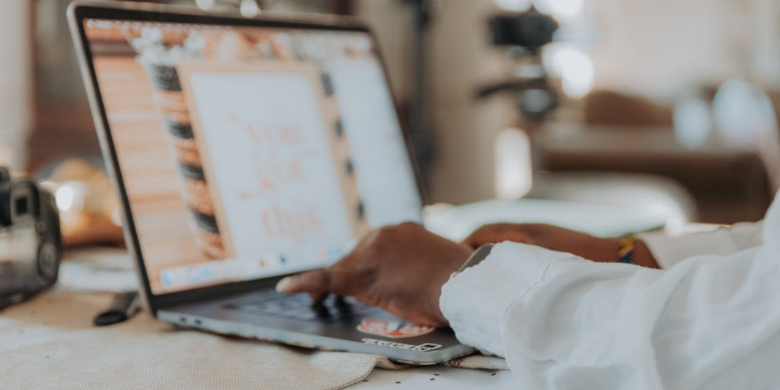 person-laptop a person holding hands on a laptop