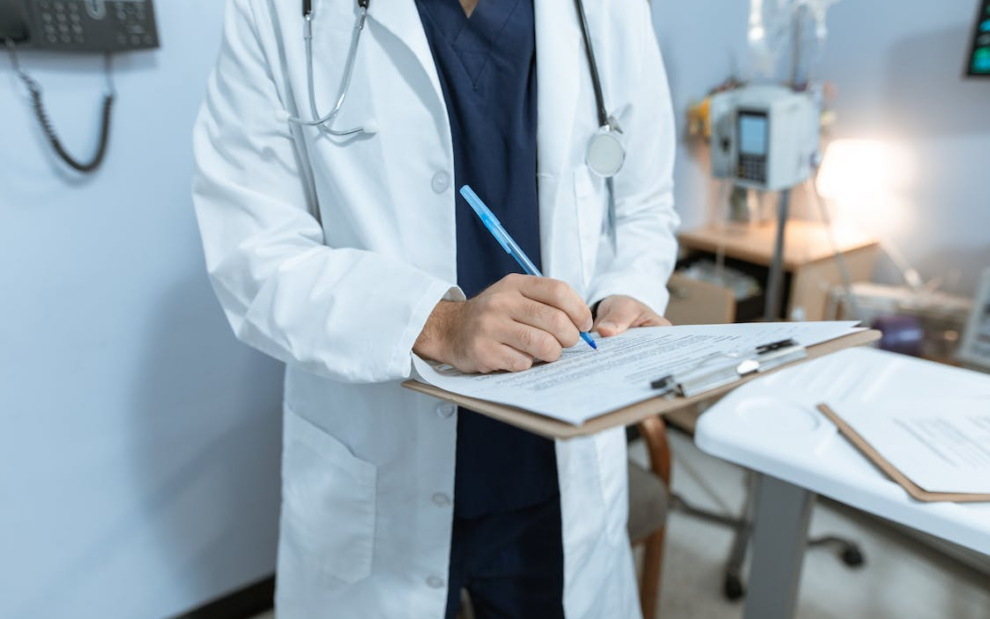 a doctor is writing a report.