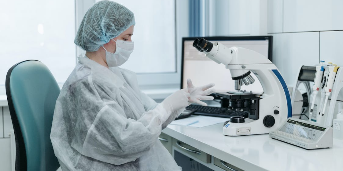 a medical researcher analyzing a sample.