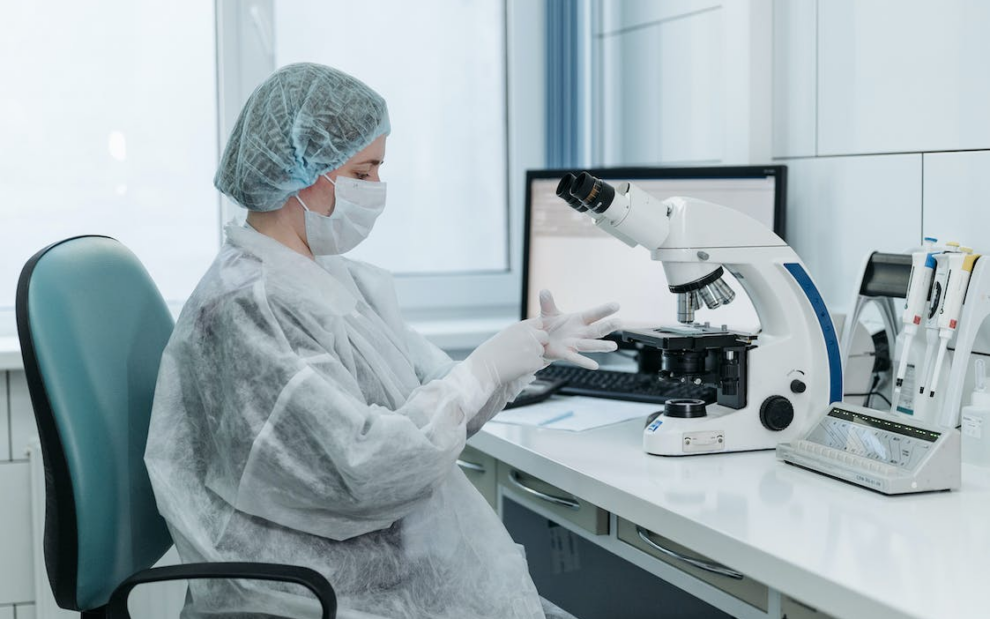 a medical researcher analyzing a sample.